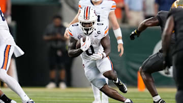Aug 29, 2025; Waco, Texas, USA;  Auburn Tigers running back Damari Alston (0) runs the ball against the Baylor Bears during the first half at McLane Stadium. Mandatory Credit: Chris Jones-Imagn Images