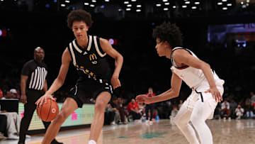 Apr 1, 2025; Brooklyn, NY, USA; McDonald's All American East forward Nate Ament (10) dribbles the ball against McDonald's All American West guard Mikel Brown Jr. (11) during the second half of the game at Barclays Center. Mandatory Credit: Pamela Smith-Imagn Images