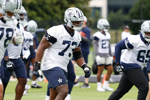 Dallas Cowboys guard Tyler Smith goes through a drill during practice at the Ford Center.