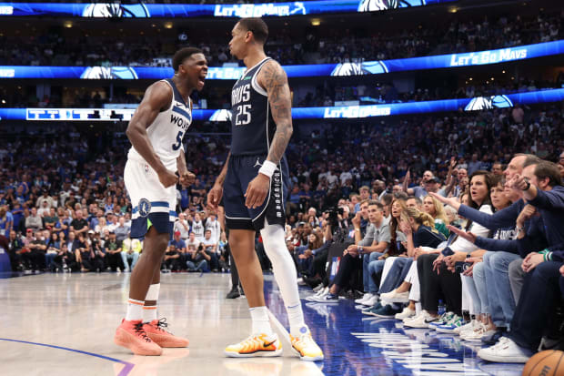 May 28, 2024; Dallas, Texas, USA; Minnesota Timberwolves guard Anthony Edwards (5) reacts in front of Dallas Mavericks forward P.J. Washington (25) during the fourth quarter of game four of the western conference finals for the 2024 NBA playoffs at American Airlines Center. 