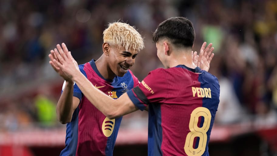 Lamine Yamal and Pedri celebrate for Barcelona