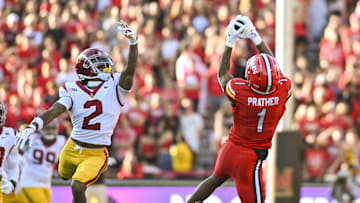 Oct 19, 2024; College Park, Maryland, USA;  Maryland Terrapins wide receiver Kaden Prather (1) catches a pass as Southern California Trojans cornerback Jaylin Smith (2) defends during the first half at SECU Stadium.