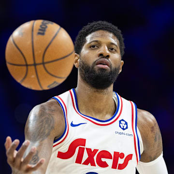 Mar 1, 2025; Philadelphia, Pennsylvania, USA; Philadelphia 76ers forward Paul George (8) catches a ball against the Golden State Warriors during the third quarter at Wells Fargo Center. Mandatory Credit: Bill Streicher-Imagn Images