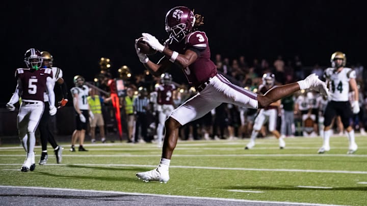 First Baptist Academy Lions receiver Jayden Petit (3) catches a pass for a touchdown during the third quarter of the Class 1S state semifinal against the Trinity Catholic Celtics at First Baptist Academy in Naples on Friday, Dec. 1, 2023.