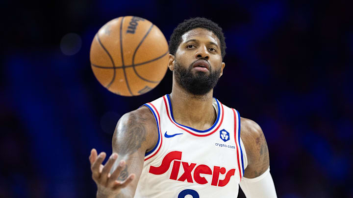 Philadelphia 76ers forward Paul George catches a ball against the Golden State Warriors. Philadelphia 76ers forward Paul George catches a ball against the Golden State Warriors.