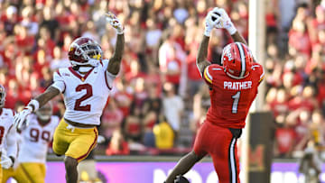 Oct 19, 2024; College Park, Maryland, USA;  Maryland Terrapins wide receiver Kaden Prather (1) catchers a pass as Southern California Trojans cornerback Jaylin Smith (2) defends during the first half at SECU Stadium. Mandatory Credit: Tommy Gilligan-Imagn Images