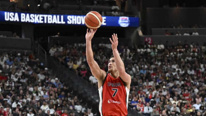 Jul 10, 2024; Las Vegas, Nevada, USA; Canada forward Dwight Powell (7) shoots the ball against USA in the third quarter of the USA Basketball Showcase at T-Mobile Arena. Mandatory Credit: Candice Ward-USA TODAY Sports