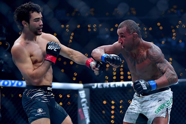 Payton Talbott (red gloves) fights Raoni Barcelos (blue gloves) during UFC 311 at Intuit Dome.