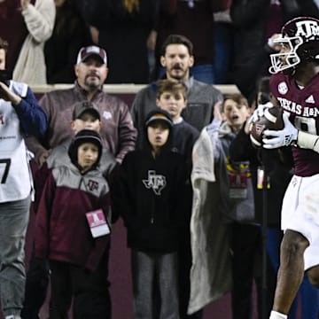 Nov 26, 2022; College Station, Texas, USA; Texas A&M Aggies tight end Donovan Green (18) catches a pass for a touchdown against the LSU Tigers during the second quarter at Kyle Field. Mandatory Credit: Jerome Miron-Imagn Images