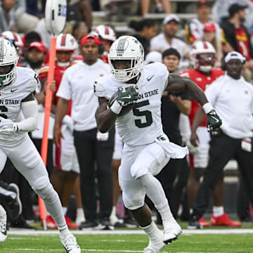 Sep 7, 2024; College Park, Maryland, USA; Michigan State Spartans running back Nate Carter (5) runs with the ball during the first half against the Maryland Terrapins at SECU Stadium. Mandatory Credit: Tommy Gilligan-Imagn Images