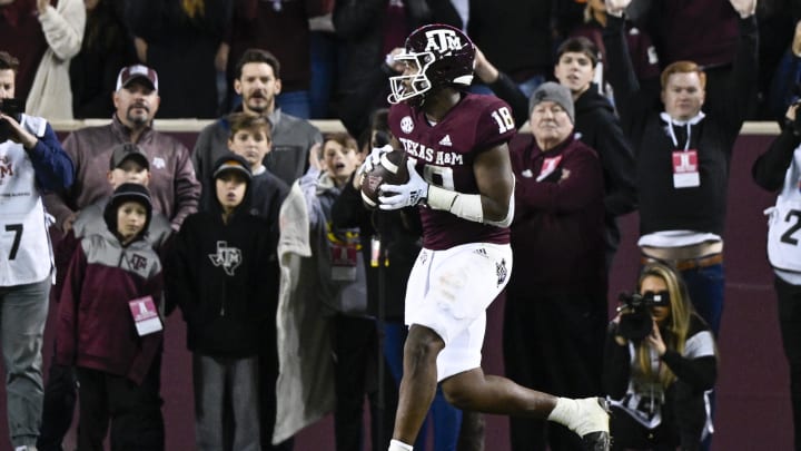 Nov 26, 2022; College Station, Texas, USA; Texas A&M Aggies tight end Donovan Green (18) catches a pass for a touchdown against the LSU Tigers during the second quarter at Kyle Field. Mandatory Credit: Jerome Miron-USA TODAY Sports