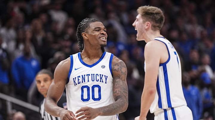 Nov 12, 2024; Atlanta, Georgia, USA; Kentucky Wildcats guard Otega Oweh (00) reacts with forward Andrew Carr (7) against the Duke Blue Devils during the second half at State Farm Arena. Mandatory Credit: Dale Zanine-Imagn Images Nov 12, 2024; Atlanta, Georgia, USA; Kentucky Wildcats guard Otega Oweh (00) reacts with forward Andrew Carr (7) against the Duke Blue Devils during the second half at State Farm Arena. Mandatory Credit: Dale Zanine-Imagn Images