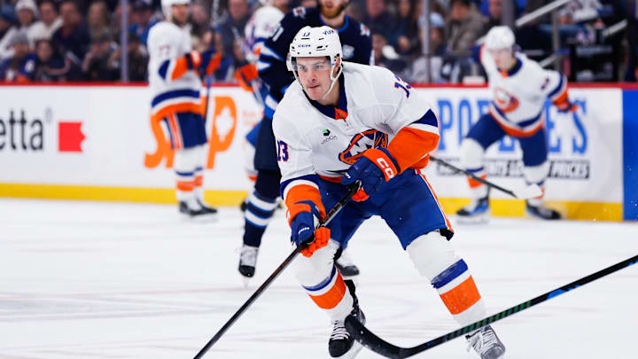 Jan 13, 2026; Winnipeg, Manitoba, CAN; New York Islanders forward Mathew Barzal (13) skates into the Winnipeg Jets zone during the first period at Canada Life Centre. Mandatory Credit: Terrence Lee-Imagn Images