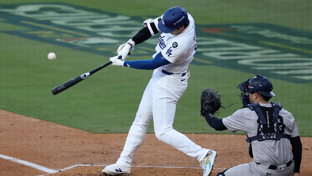 Oct 26, 2024; Los Angeles, California, USA; Los Angeles Dodgers designated hitter Shohei Ohtani (17) hits a fly ball against the New York Yankees in the first inning for game two of the 2024 MLB World Series at Dodger Stadium. Mandatory Credit: Kiyoshi Mio-Imagn Images