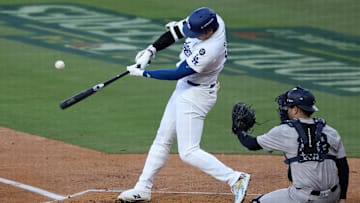 Oct 26, 2024; Los Angeles, California, USA; Los Angeles Dodgers designated hitter Shohei Ohtani (17) hits a fly ball against the New York Yankees in the first inning for game two of the 2024 MLB World Series at Dodger Stadium. Mandatory Credit: Kiyoshi Mio-Imagn Images