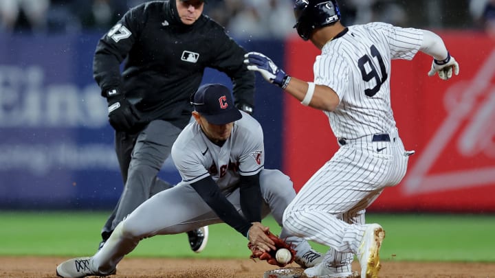 May 3, 2023; Bronx, New York, USA; New York Yankees pinch runner Oswald Peraza (91) is safe a second as the ball gets by Cleveland Guardians second baseman Andres Gimenez (0) during the ninth inning at Yankee Stadium. Mandatory Credit: Brad Penner-USA TODAY Sports