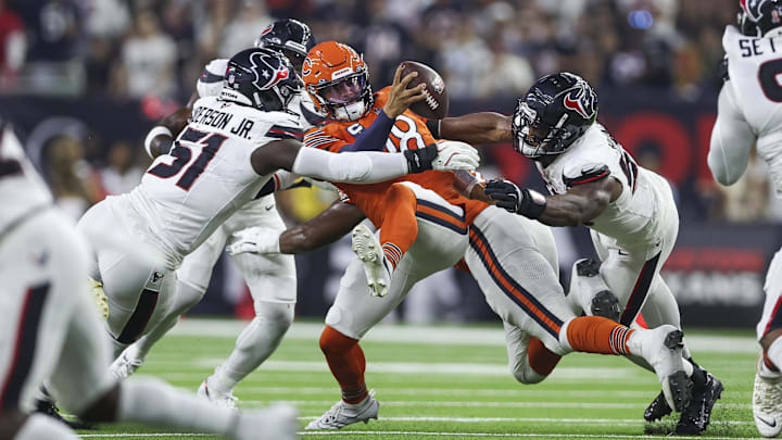 Houston Texans defensive end Will Anderson Jr. and defensive end Danielle Hunter attempt to sack Williams during the first quarter at NRG Stadium.