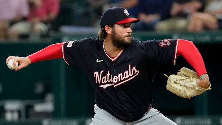 Aug 18, 2026; Arlington, Texas, USA; Washington Nationals pitcher Trevor Williams (32) delivers a pitch to the Texas Rangers during the seventh inning at Globe Life Field. Mandatory Credit: Jim Cowsert-Imagn Images
