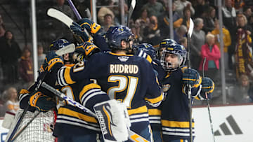 The Augustana Vikings celebrate their 5-4 win over the ASU Sun Devils at Mullett Arena in Tempe on Jan. 19, 2024.