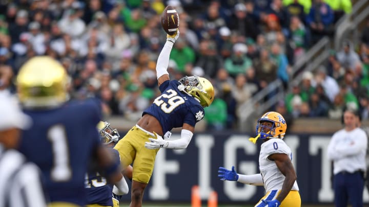 Oct 28, 2023; South Bend, Indiana, USA; Notre Dame Fighting Irish cornerback Christian Gray (29) intercepts a pass intended for Pittsburgh Panthers wide receiver Bub Means (0) in the third quarter at Notre Dame Stadium. Mandatory Credit: Matt Cashore-USA TODAY Sports