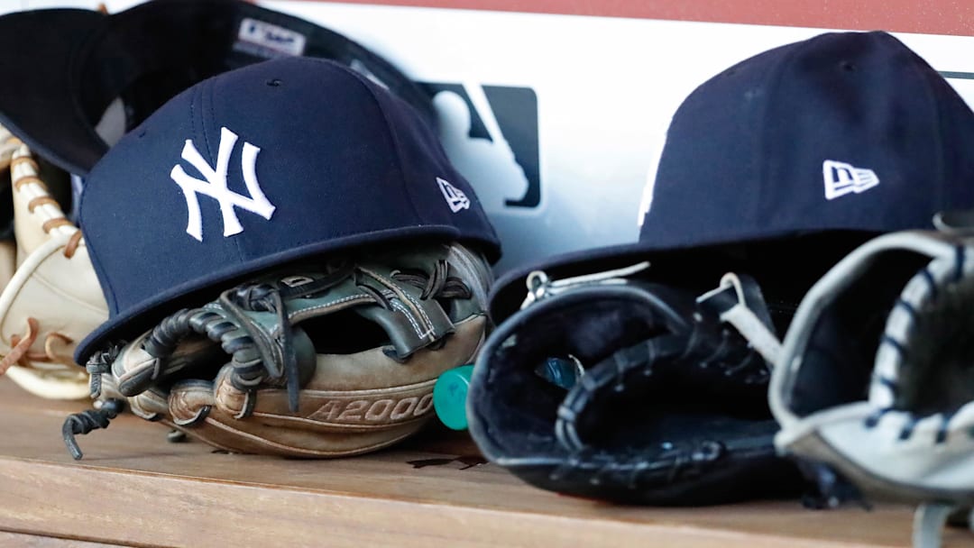 Jun 18, 2018; Washington, DC, USA; New York Yankees players caps and gloves rest in the dugout against the Washington Nationals at Nationals Park. Jun 18, 2018; Washington, DC, USA; New York Yankees players caps and gloves rest in the dugout against the Washington Nationals at Nationals Park.