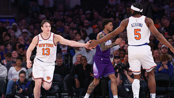 New York Knicks guard Tyler Kolek (13) slaps hands with forward Precious Achiuwa (5) during the first half against the Utah Jazz at Madison Square Garden. New York Knicks guard Tyler Kolek (13) slaps hands with forward Precious Achiuwa (5) during the first half against the Utah Jazz at Madison Square Garden.
