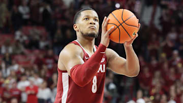 Feb 8, 2025; Fayetteville, Arkansas, USA; Alabama Crimson Tide guard Chris Youngblood (8) shoots a free throw toward the end of the second half against the Arkansas Razorbacks at Bud Walton Arena. Alabama won 85-81. Mandatory Credit: Nelson Chenault-Imagn Images