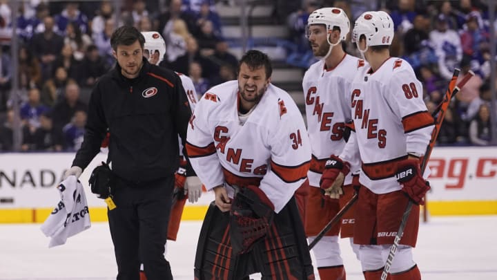 Feb 22, 2020; Toronto, Ontario, CAN; Carolina Hurricanes goaltender Petr Mrazek (34) comes off the ice after a collision with Toronto Maple Leafs forward Kyle Clifford (not pictured) during the second period at Scotiabank Arena. Mandatory Credit: John E. Sokolowski-USA TODAY Sports