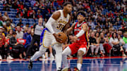 Nov 14, 2025; New Orleans, Louisiana, USA;  Los Angeles Lakers guard Marcus Smart (36) drives to the basket against New Orleans Pelicans guard Jeremiah Fears (0) during the first half at Smoothie King Center. Mandatory Credit: Stephen Lew-Imagn Images