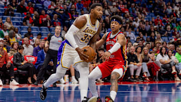 Nov 14, 2025; New Orleans, Louisiana, USA;  Los Angeles Lakers guard Marcus Smart (36) drives to the basket against New Orleans Pelicans guard Jeremiah Fears (0) during the first half at Smoothie King Center. Mandatory Credit: Stephen Lew-Imagn Images