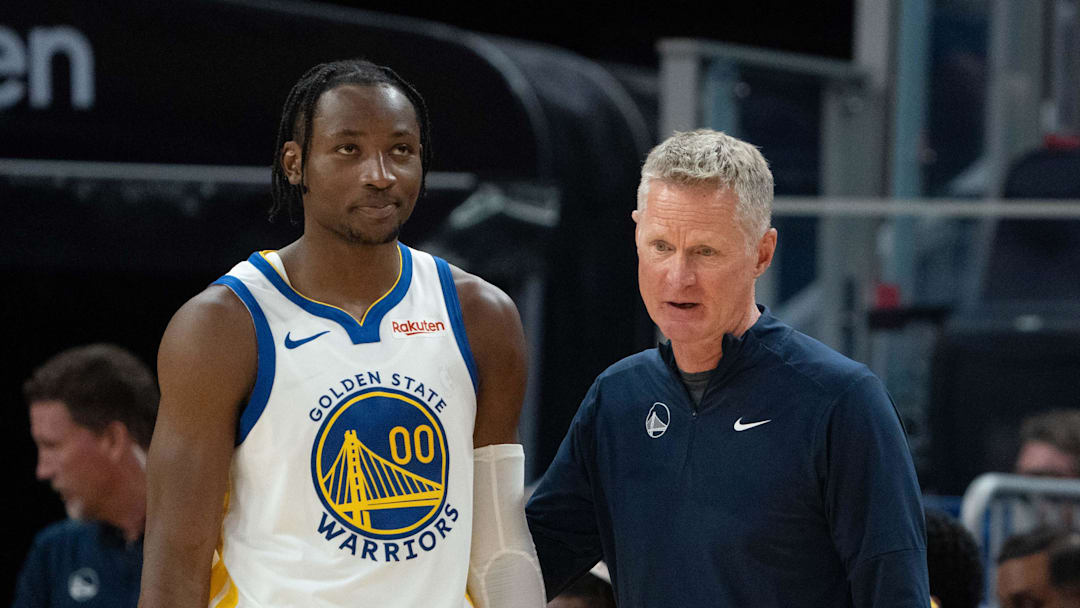 October 20, 2023; San Francisco, California, USA; Golden State Warriors head coach Steve Kerr (right) talks to forward Jonathan Kuminga (00) during the third quarter against the San Antonio Spurs at Chase Center. Mandatory Credit: Kyle Terada-Imagn Images