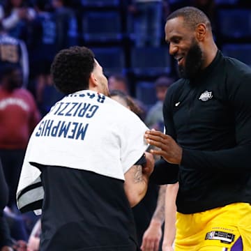 Mar 27, 2024; Memphis, Tennessee, USA; Memphis Grizzlies guard Scotty Pippen Jr. (1) and Los Angeles Lakers forward LeBron James (23) embrace after the game at FedExForum. Mandatory Credit: Petre Thomas-Imagn Images