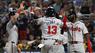 May 24, 2024; Pittsburgh, Pennsylvania, USA;  Atlanta Braves third baseman Zack Short (left) and Atlanta center fielder Michael Harris II (right) congratulate right fielder  Ronald Acuna Jr. (13) crossing home plate on a three-run home run against the Pittsburgh Pirates during the eighth inning at PNC Park. Mandatory Credit: Charles LeClaire-Imagn Images