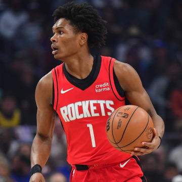 Apr 14, 2024; Los Angeles, California, USA; Houston Rockets forward Amen Thompson (1) controls the ball against the Los Angeles Clippers during the first half at Crypto.com Arena. Mandatory Credit: Gary A. Vasquez-USA TODAY Sports