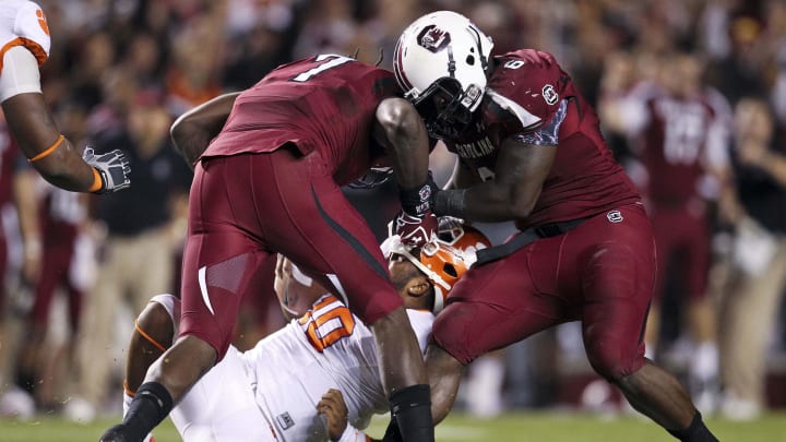 South Carolina Gamecocks legends Jadeveon Clowney and Melvin Ingram meeting to sack Clemson Tigers quarterback Tajh Boyd