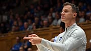 Nov 21, 2025; Durham, North Carolina, USA; Duke Blue Devils head coach Jon Scheyer directs his team during the first half against the Niagara Purple Eagles at Cameron Indoor Stadium. Mandatory Credit: Rob Kinnan-Imagn Images