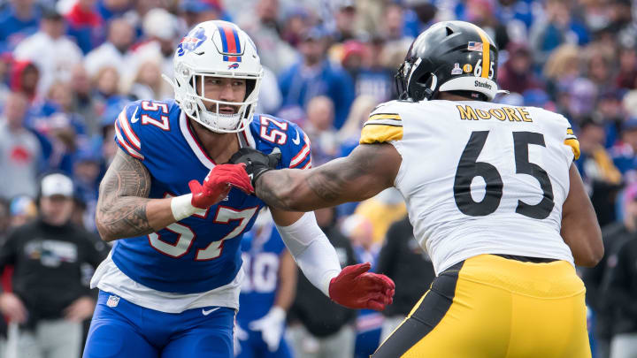 Oct 9, 2022; Orchard Park, New York, USA; Buffalo Bills defensive end AJ Epenesa (57) and Pittsburgh Steelers offensive tackle Dan Moore Jr. (65) in the fourth quarter at Highmark Stadium. Mandatory Credit: Mark Konezny-USA TODAY Sports