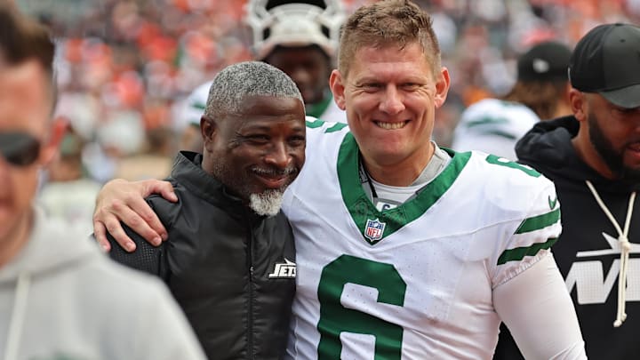 Jets head coach Aaron Glenn and kicker Nick Folk celebrate their first win of the season. Jets head coach Aaron Glenn and kicker Nick Folk celebrate their first win of the season.