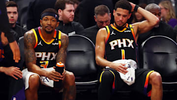 Apr 9, 2025; Phoenix, Arizona, USA; Phoenix Suns guard Bradley Beal (3) and guard Devin Booker (1) react on the bench against the Oklahoma City Thunder during the fourth quarter at Footprint Center. Mandatory Credit: Mark J. Rebilas-Imagn Images
