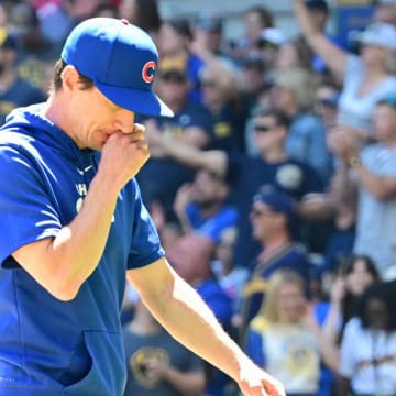 Jun 30, 2024; Milwaukee, Wisconsin, USA; Chicago Cubs manager Craig Counsell walks back to the dugout after making a pitching change in the fourth inning against the Milwaukee Brewers at American Family Field. 