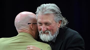 Former Zips basketball coach Bob Huggins, facing, hugs current coach John Groce after speaking during the Akron Basketball reunion and celebration at the University of Akron student union, Saturday, July 27, 2024, in Akron, Ohio.