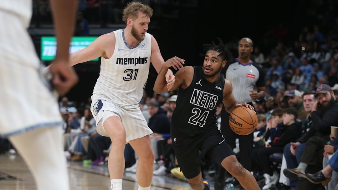 Jan 11, 2026; Memphis, Tennessee, USA; Brooklyn Nets guard Cam Thomas (24) dribbles as Memphis Grizzlies center Jock Landale (31) defends during the second quarter at FedExForum. Mandatory Credit: Petre Thomas-Imagn Images