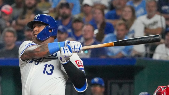 Aug 19, 2024; Kansas City, Missouri, USA; Kansas City Royals catcher Salvador Perez (13) hits a two-run double against the Los Angeles Angels in the seventh inning at Kauffman Stadium. Mandatory Credit: Denny Medley-USA TODAY Sports