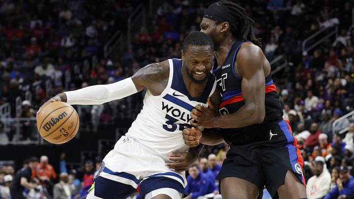 Jan 4, 2025; Detroit, Michigan, USA;  Minnesota Timberwolves forward Julius Randle (30) is defended by Detroit Pistons center Isaiah Stewart (28): Rick Osentoski-Imagn Images