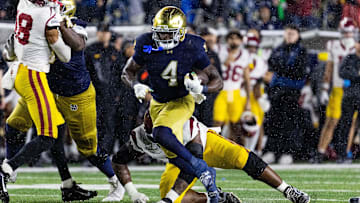 Oct 18, 2025; South Bend, Indiana, USA; Notre Dame Fighting Irish running back Jeremiyah Love (4) runs the ball against the Southern California Trojans  in the second half at Notre Dame Stadium. Mandatory Credit: Trevor Ruszkowski-Imagn Images