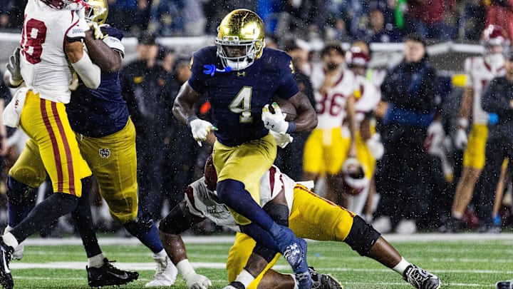 Oct 18, 2025; South Bend, Indiana, USA; Notre Dame Fighting Irish running back Jeremiyah Love (4) runs the ball against the Southern California Trojans  in the second half at Notre Dame Stadium. Mandatory Credit: Trevor Ruszkowski-Imagn Images