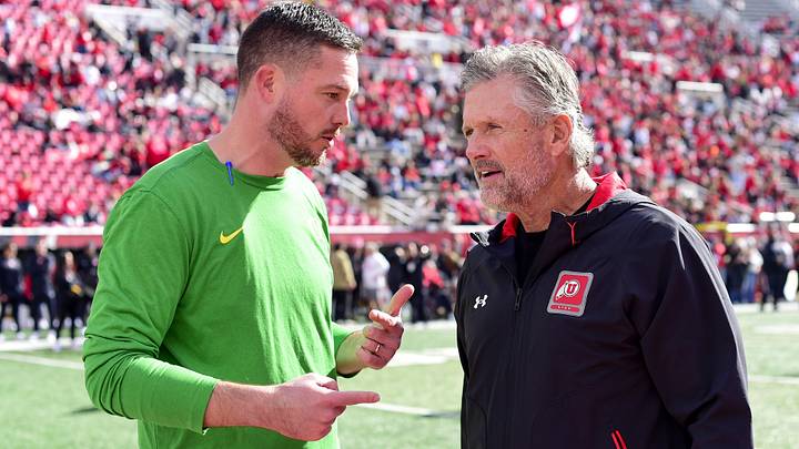 Oct 28, 2023; Salt Lake City, Utah, USA; Oregon Ducks head coach Dan Lanning speaks with Utah Utes head coach Kyle Whittingham before a game at Rice-Eccles Stadium. Mandatory Credit: Christopher Creveling-Imagn Images
