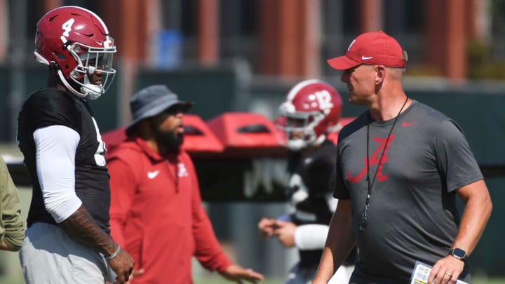 The Alabama Crimson Tide football team works out Sunday morning in practice as they prepare for the 2024 season. Alabama quarterback Jalen Milroe (4) listens to directions from Alabama head coach Kalen DeBoer.