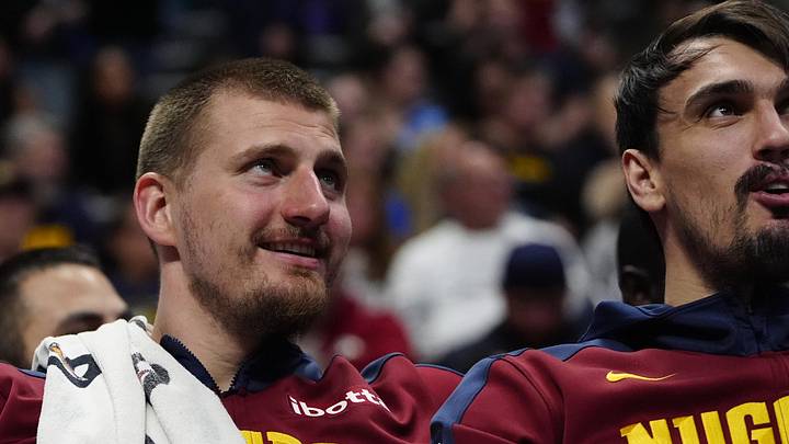 Mar 28, 2025; Denver, Colorado, USA; Denver Nuggets center Nikola Jokic (15) reacts from the bench in the fourth quarter against the Utah Jazz at Ball Arena. Mandatory Credit: Ron Chenoy-Imagn Images