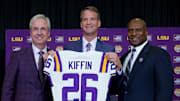 Dec 1, 2025; Baton Rouge, LA, USA; LSU president Wade Rousse, left, LSU new head coach Lane Kiffin and LSU athletic director Verge Ausberry stand together at South Stadium Club at Tiger Stadium. Mandatory Credit: Matthew Hinton-Imagn Images